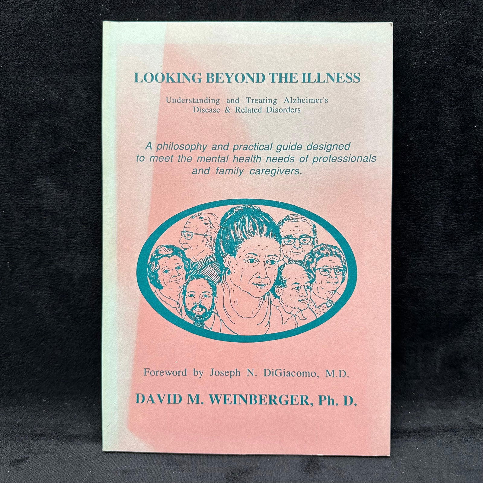 Looking Beyond The Illness Signed Softcover Book: Signed by David M. Weinberger with a personal inscription to Michel Roux. Condition shows general handling wear, scuffing, and surface marks to the cover consistent with age. Interior pages appear int
