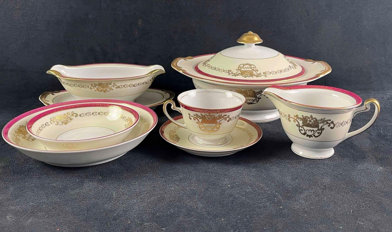 China Set White China with Red and Gold Design: China Set White China with Red and Gold Design This is a 50pc china set that has "Made in Japan" on the bottom with no brand stamp. This is a great small set that has elegant red and gold