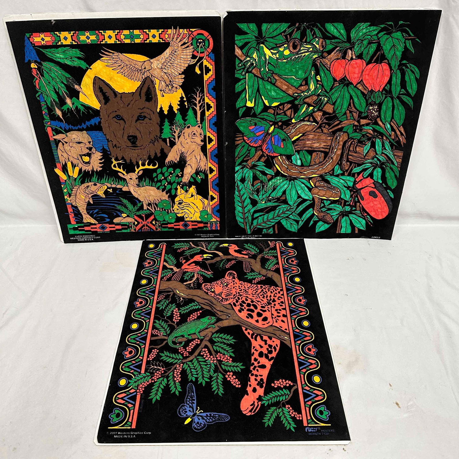 Lot of Three Fuzzy Posters Wildlife and Jungle Themes Western Graphics: Offered here is a vibrant set of three original fuzzy velvet posters produced by Western Graphics Corp., dated 1997 and 2001. These nostalgic posters feature bold, colorful designs against flocked bla