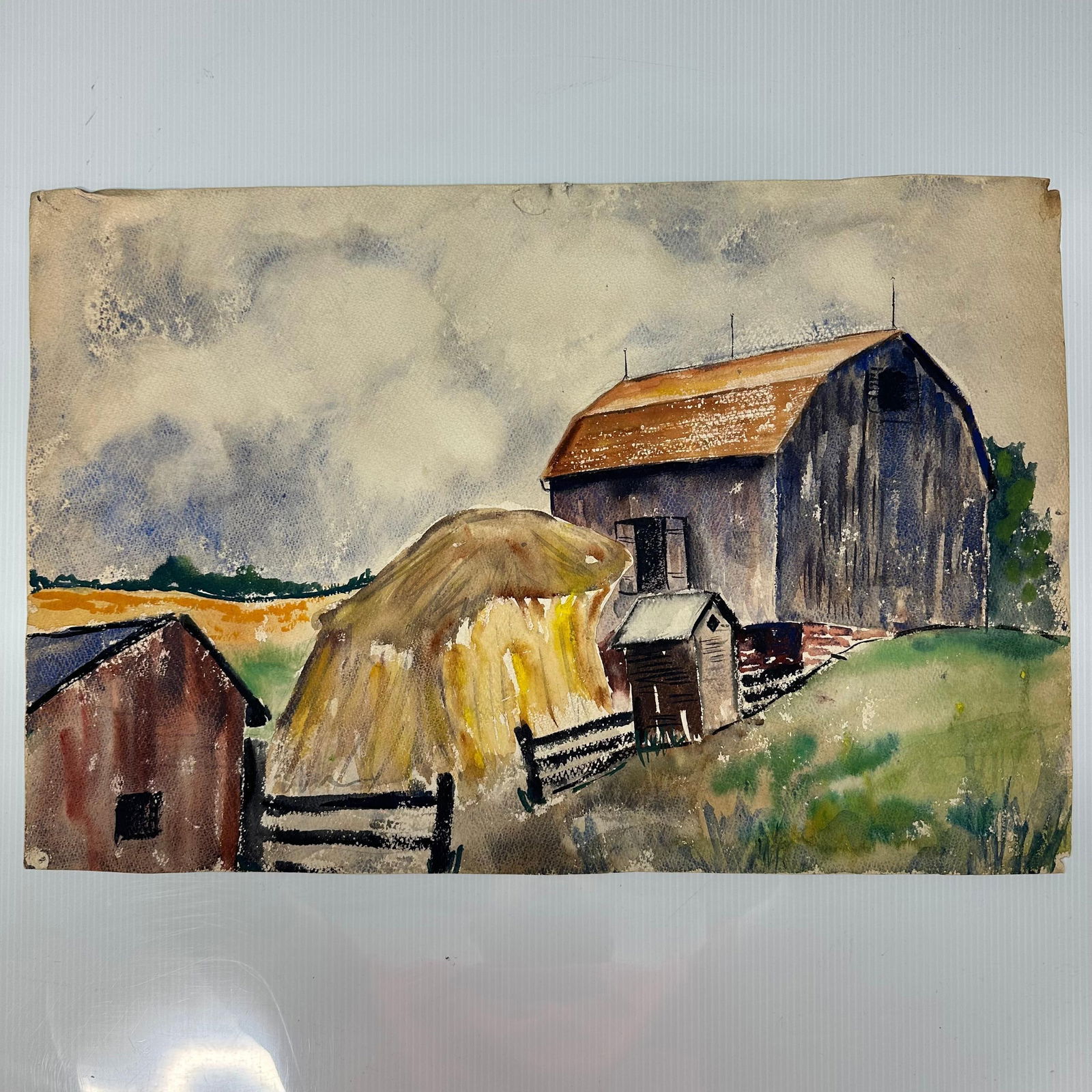 Double Sided Rural Landscape Watercolor Paintings Inscribed J. Swanson: A double-sided original watercolor painting depicting rural scenes. One shows a farm landscape with barn, haystack, fencing, and rolling fields under a cloudy sky. The second depicts a roadside scene