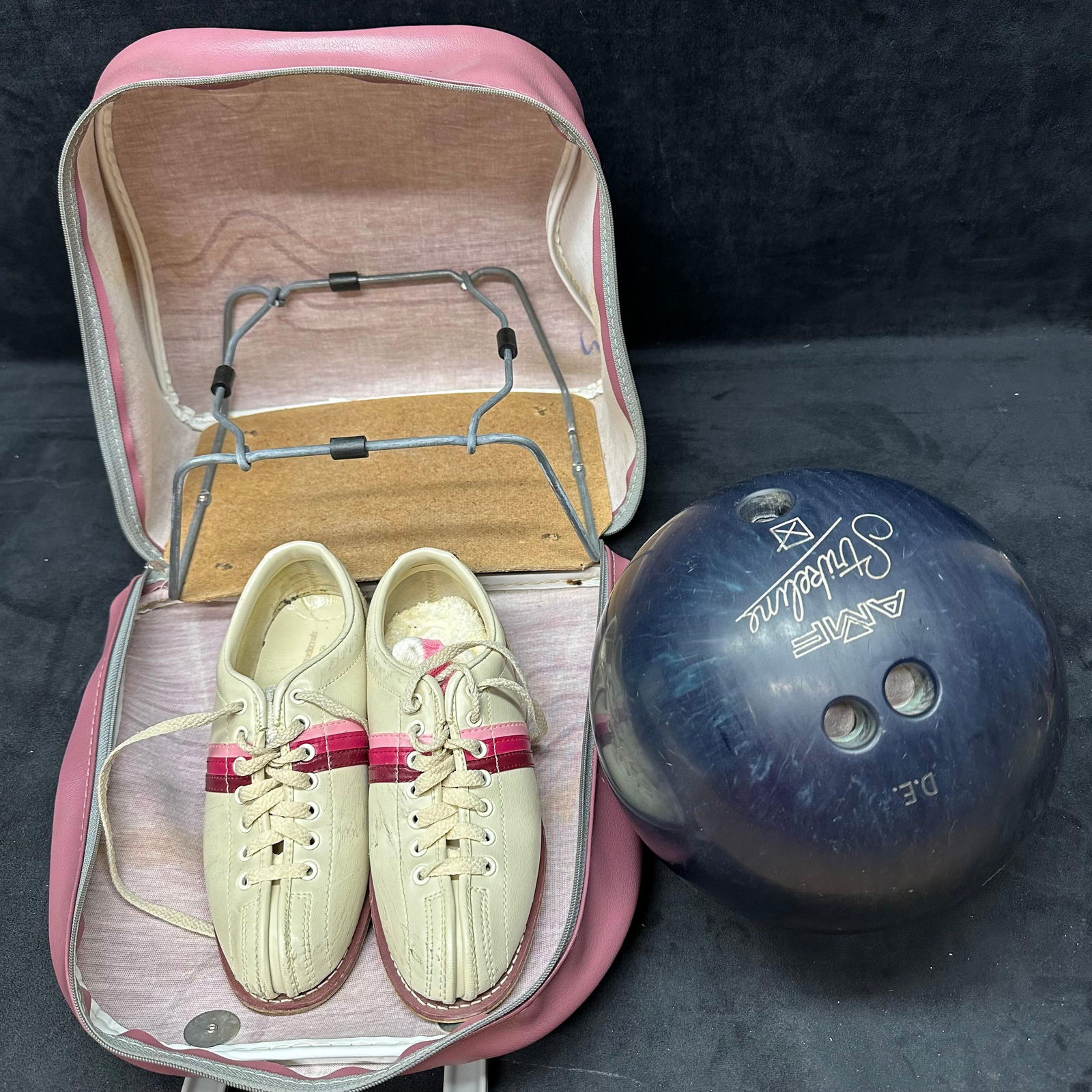 AMF Strikeline Bowling Ball with Brunswick Pink Carry Case and Bowling Shoes: Vintage AMF Strikeline bowling ball personalized, marked “D.E.” with three drilled finger holes and blue marbled finish. Includes a Brunswick pink and cream vinyl bowling ball carrying case