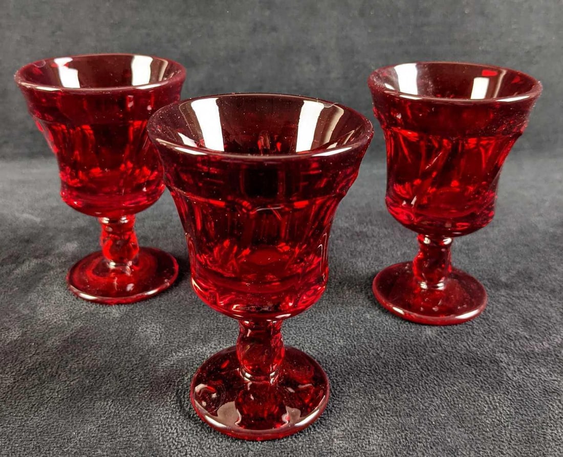 Three Fostoria Jamestown Ruby Juice Glasses: Three Vintage Retired Ruby Fostoria Juice Glasses. The "Jamestown Ruby" deign was released from 1964 to 1982. Each glass is approx 3" x 3" x 4 1/4" and are in a good,vintage condition with no known