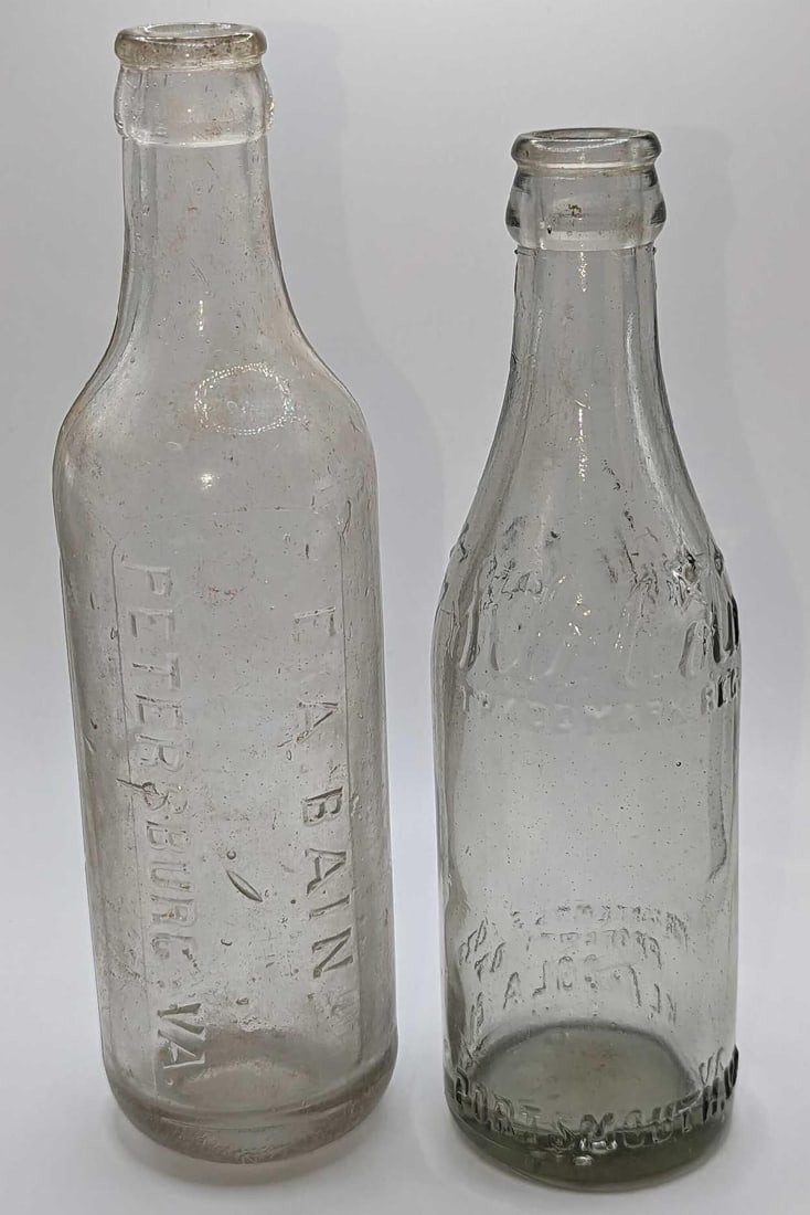 2 Vintage Kli-Cola And E.A. Bain Glass Bottles: 2 Vintage Kli-Cola And E.A. Bain Glass Bottles. This lot includes: (1) Vintage Kli-Cola 6 1/2 oz Glass Bottle. From Portsmouth, VA. This is approx 2 1/2" x 2 1/2" x 8". The bottle has