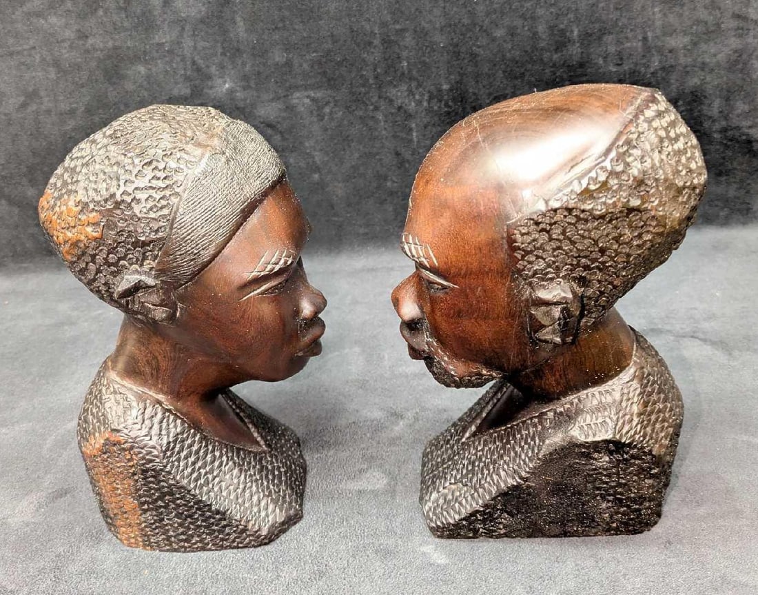 Hand Carved Wooden African Kenya Man And Woman Sculptures: Hand Carved Wooden African Kenya Man And Woman Sculptures. Was told this was purchased from Kenya and was made of a "African Hardwood", which appears to be Mahogany. The man is approx 4" x 5" x 8 3/4"