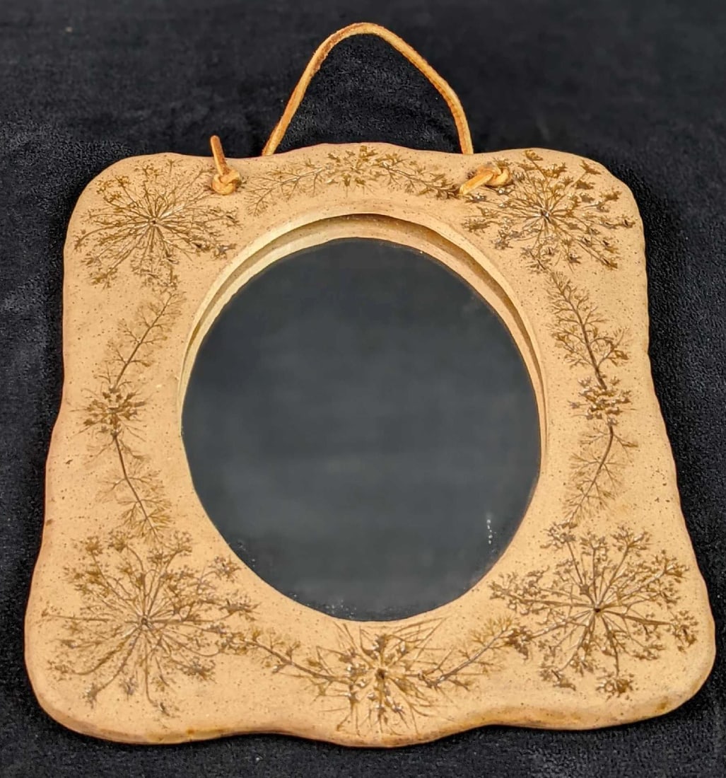 Anna Brown Hanging Mirror With Handmade Ceramic Frame: Anna Brown Hanging Mirror With A Ceramic Frame. The frame was hand-made by an artist who also signed the back of it. The mirror is approx 8" x 9 1/2". The mirror is in a good, used condition with some