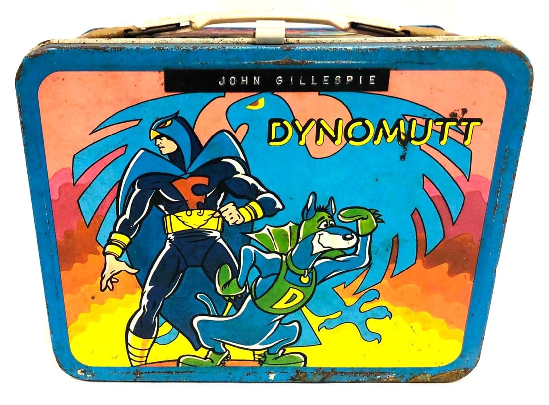 1967 Dynomutt Blue Falcon Lunch Box: This lot contains a 1967 Dynomutt Blue Falcon Lunch Box. It is approx 8 3/4" x 4 1/4" x 8" and it weighs about 0.9lbs. Overall the lunchbox is in good used condition with some wear consistent wit
