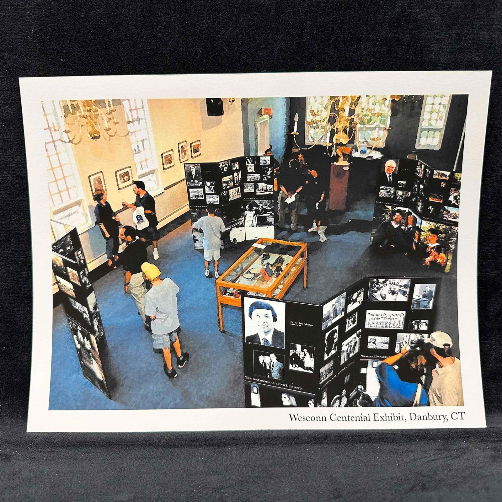 Wesconn Centennial Exhibit Photo Print Danbury, CT: Color photograph print depicting the Wesconn Centennial Exhibit in Danbury, Connecticut. The image captures a lively exhibit space with visitors viewing a series of black-and-white historical photo pa