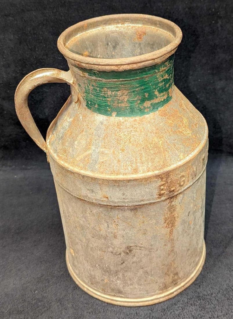 Vintage Elgin Milk Production Chicago Milk Jug: Vintage Elgin Milk Production Chicago Milk Jug. This is approx 7" x 6" x 10 3/4" and it weighs 3.21 lbs. The jug has some scratches and surface rust. Please see the images as they are part of the
