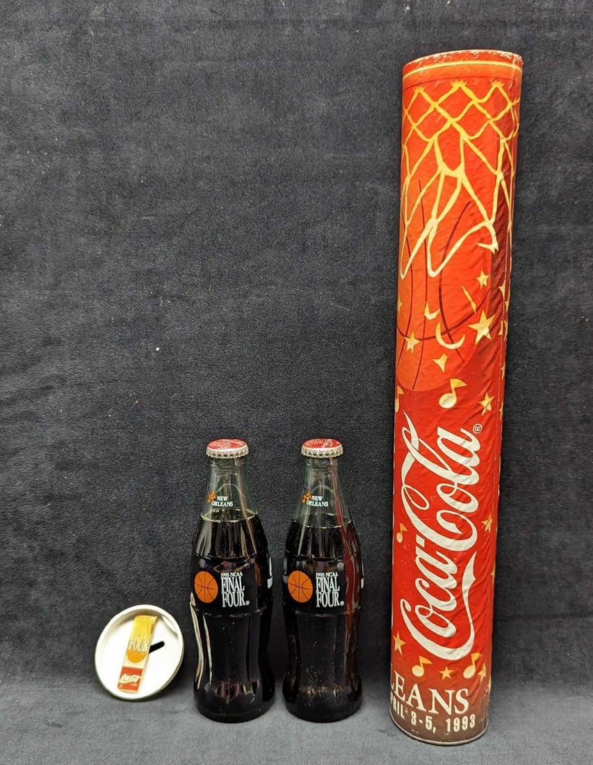Coca Cola 1993 New Orleans Basketball Tube: Coca Cola 1993 New Orleans Basketball Tube. This tube comes with: (1) 1993 NCCA Final Four Coca Cola Pin. There are some markings on the back of the pin. (2) 8 FL OZ 1993 NCAA Final Four Glass Coca C