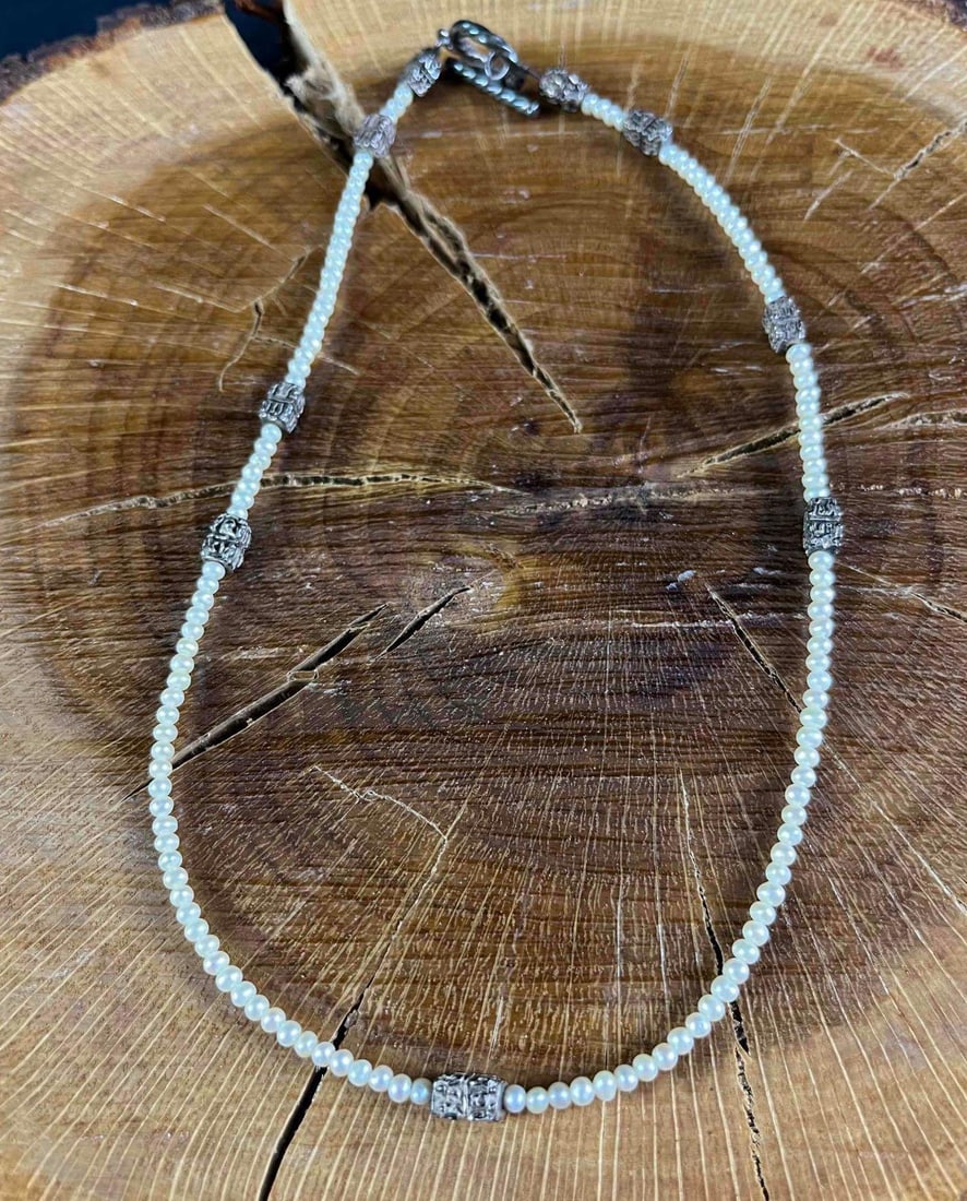 Seed Pearl Sterling Silver Necklace: Seed Pearl Sterling Silver Necklace pictured is a beautiful freshwater seed pearl necklace with sterling silver accent beads, wire, and clasp. This necklace is in good condition with just some