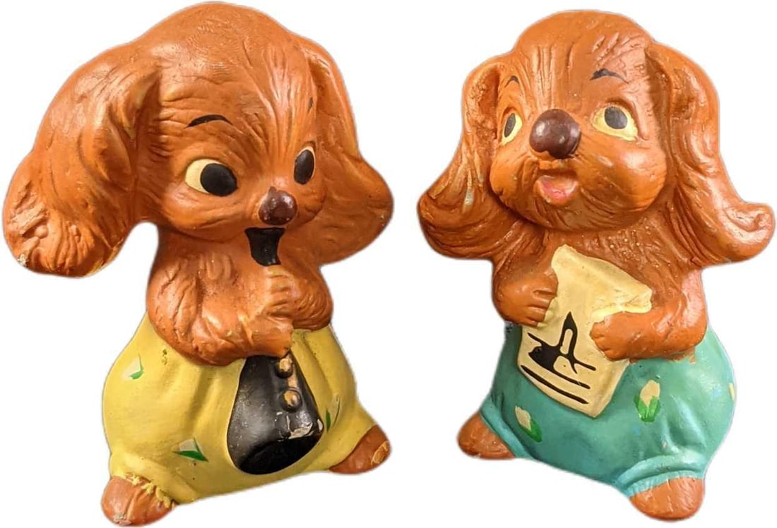 Vintage Ceramic Cocker Spaniel Pup Figurines: This lot includes: (1) One playing an instrument. This is approx 2" x 1 1/4" x 3". There is some wear on the figurine and instrument. (1) 'Singing With Sheet Music". This is appro