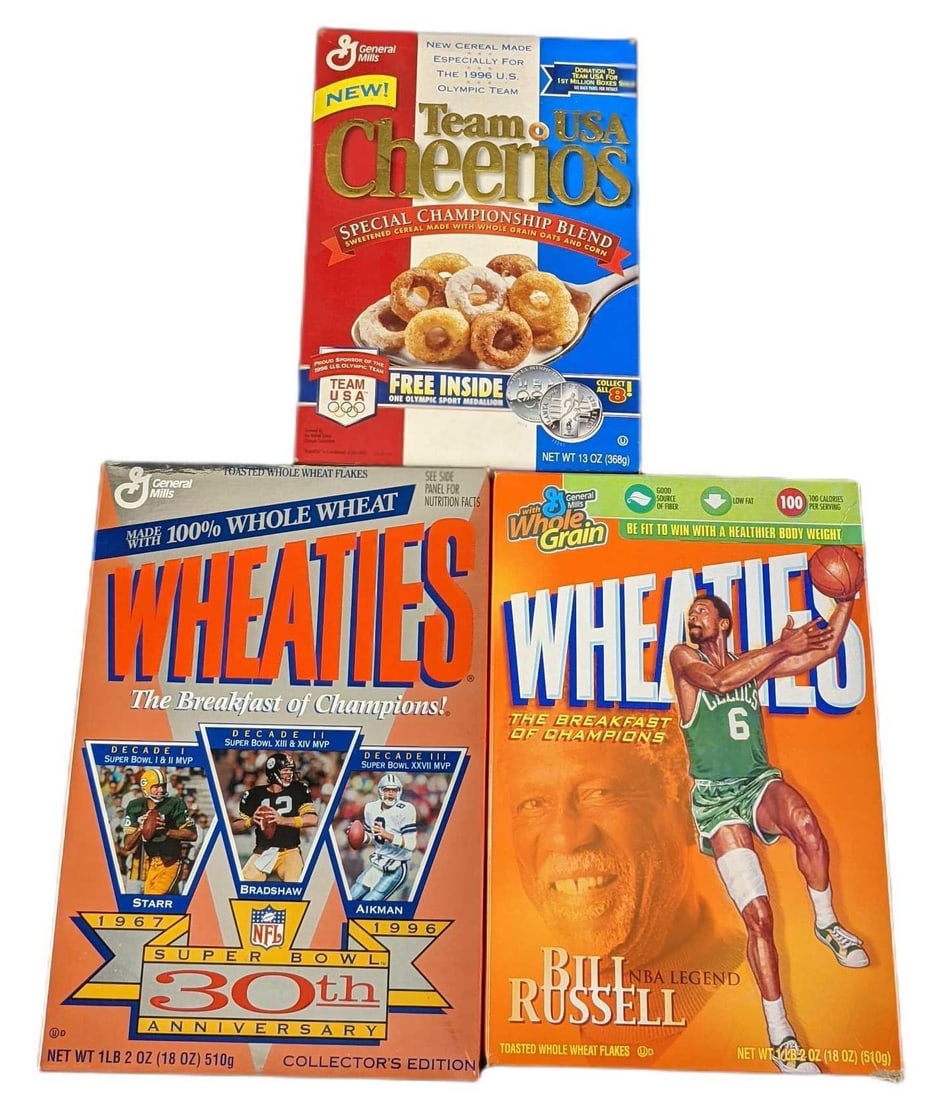 Three Collectable Cereal Boxes Cheerios Wheaties: This lot includes three empty boxes of: (1) Team USA Cheerios "Special Championship Blend". This was released on 1996. The box is approx 7 1/2" x 2 1/2" x 11". (1) Wheaties Bill L