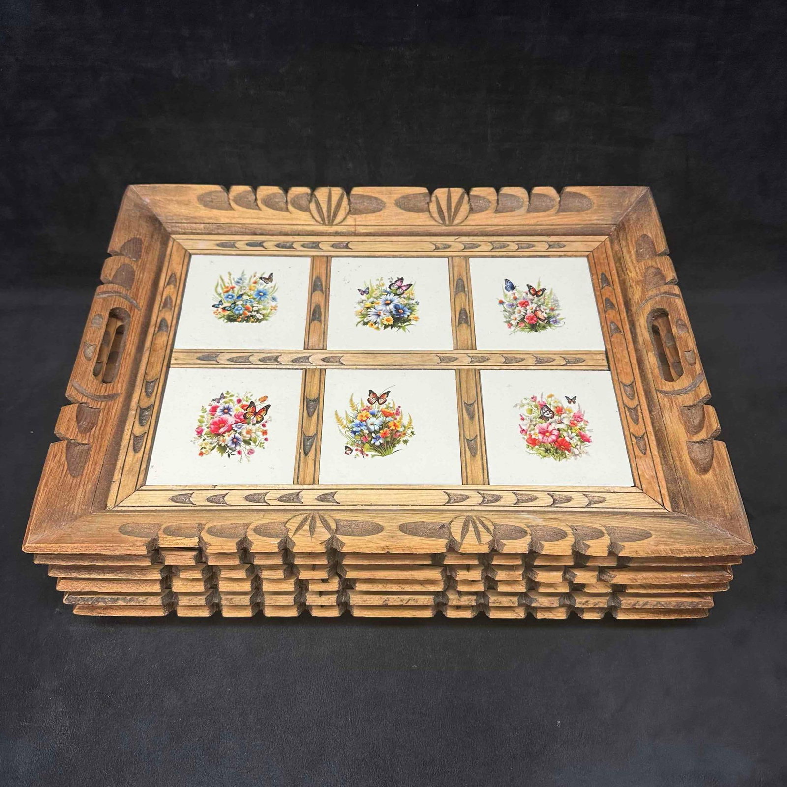 6 Vintage Wooden Serving Trays with Tile Inlays Sticker Floral Butterflies and Bird Motifs: Set of six vintage hand carved wooden serving trays featuring colorful tile inlays with sticker floral bouquets and vibrant bird and butterfly designs. Each tray has a hand-carved wooden frame with ha