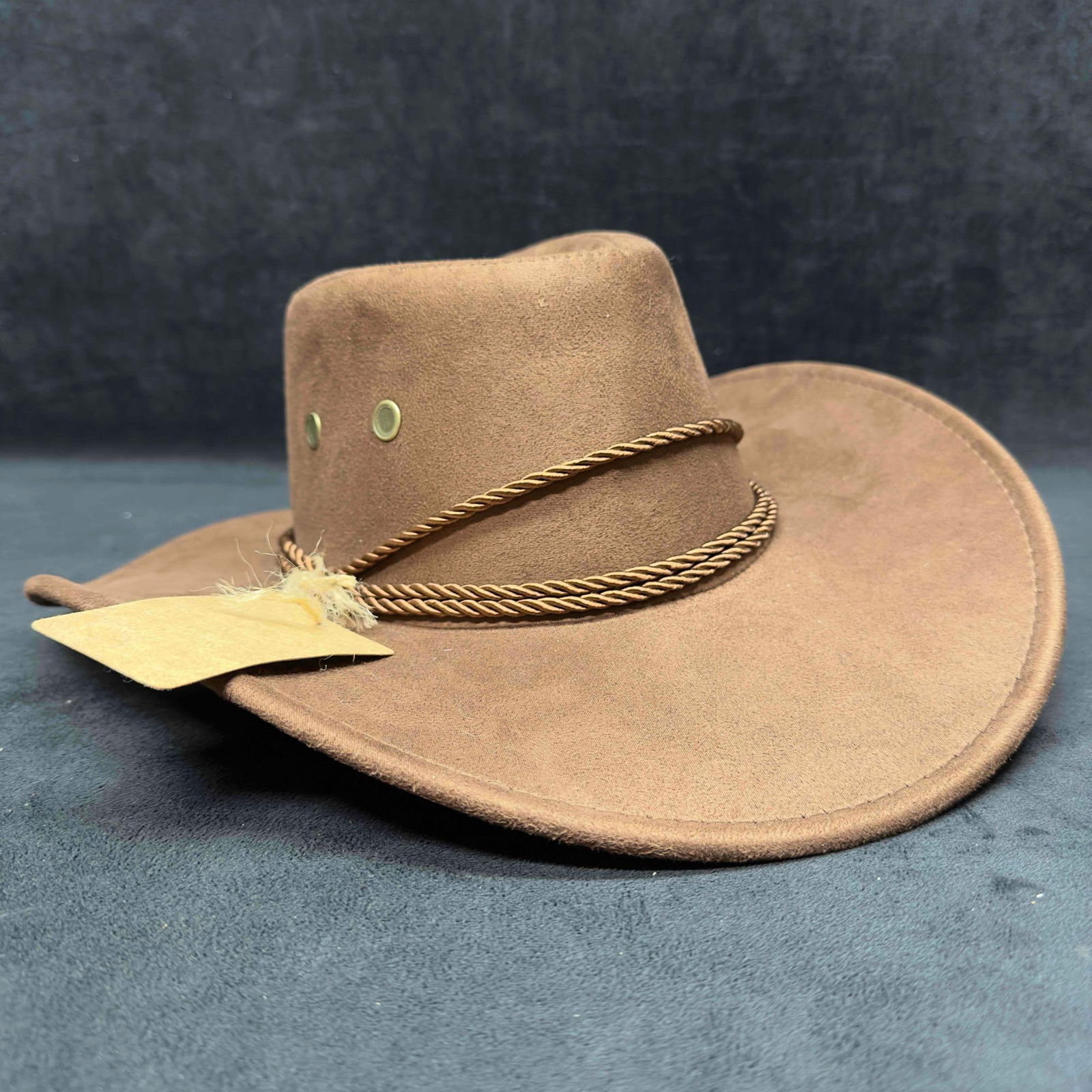 Classic Rolled Western Cowboy Hat Coffee Brown: Classic Rolled Western Cowboy Hat Coffee Brown. Original tag still intact. Two ventilation holes on each side of the crown design and a delicate drawstring design. This item is in good pre-owned,