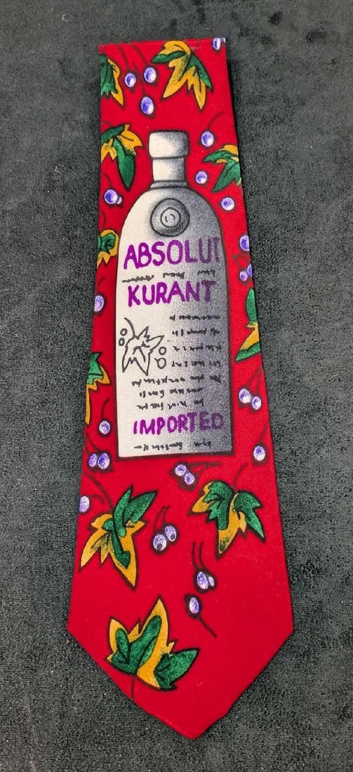 Absolut Vodka Rare Marc Lee Hauser Red Silk Tie: Absolut Vodka Rare Marc Lee Hauser Red Silk Tie. It comes in the original package that is approx 4 3/8" x 16 1/2" and it weighs 0.15lb. The tie has a small crease near the end of the tie.