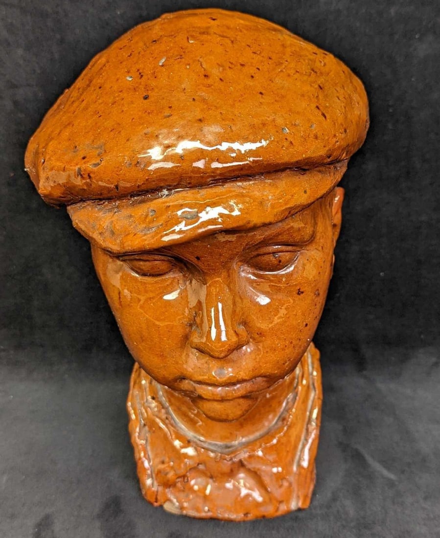 Hand Sculpted Clay Boy Head With Cap: Hand Sculpted Clay Boy Head With Cap. Here is a hand-sculpted clay head of a young boy with a cap on his head. The initials SWK are on the back. This is approx 6" x 8" x 12" and it weighs 8.53lbs.