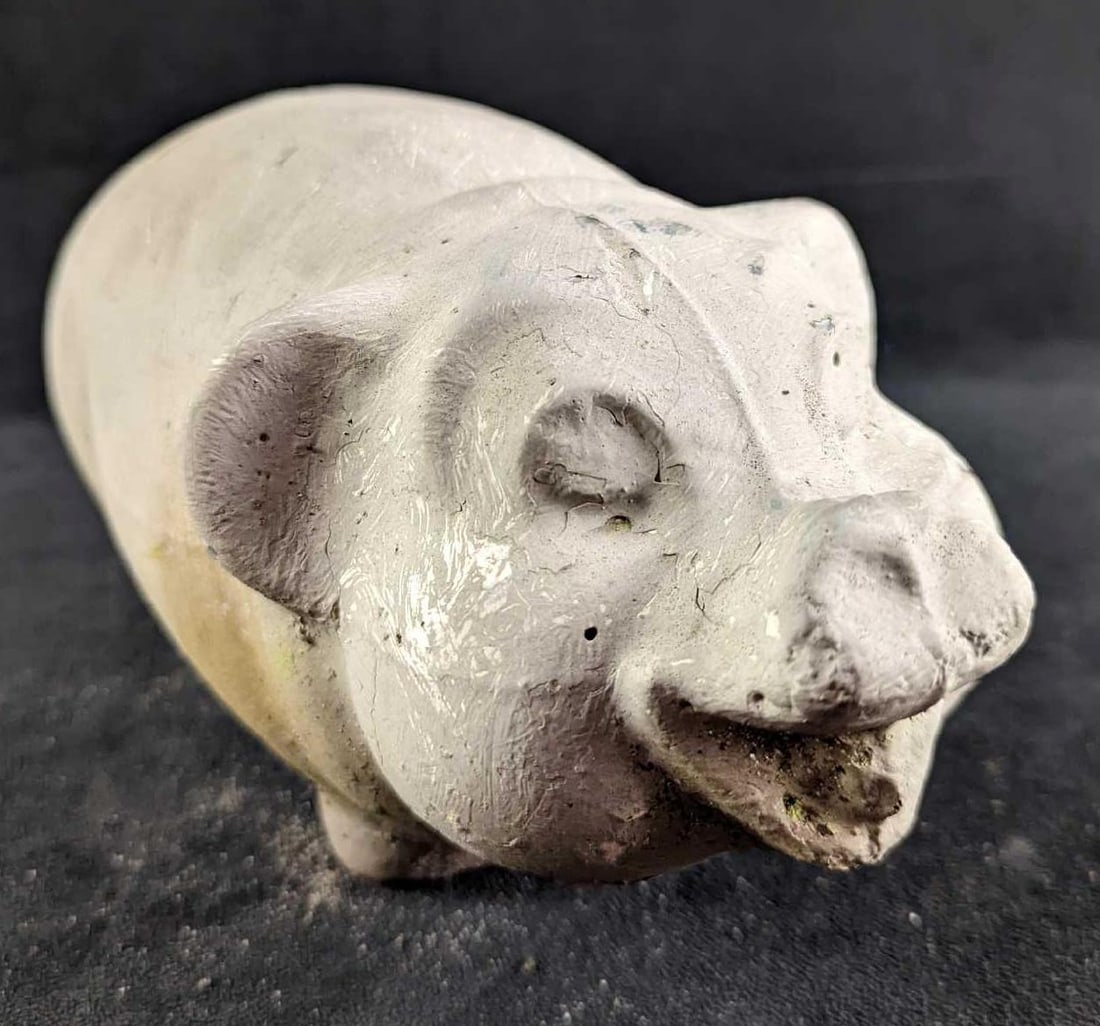 Vintage Concrete Weathered Piggy Garden Statue: Vintage Concrete Weathered Piggy Garden Statue. The maker and date of creation are unknown. This piggy is approx 5 1/2" x 11" x 6" and it weighs 15.50lbs. This very weathered piggy is in good,
