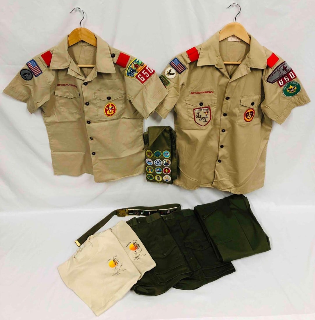 Vintage Boy Scouts Of America Memorabilia Bundle: This lot contains a Vintage Boy Scouts Of America Memorabilia Bundle. This lot includes Two pairs of Shorts Official Boy Scout Uniform, Two Troop 650 T-Shirts, Sash With 13 Badges, One Pair Of Pants O