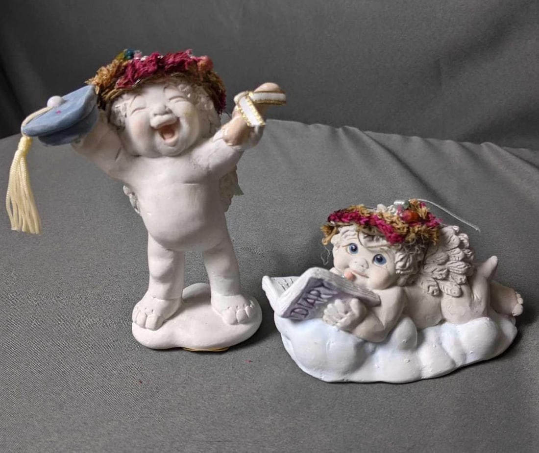 Two Dreamsicles Figurines (1) "Graduation Day" (2) "Dear Diary": Two Dreamsicles Figurines (1) "Graduation Day" (2) "Dear Diary" (1) "Graduation Day" Repair on the right arm and paint chip on diploma. 4 1/2" x 2" (2) "Dear