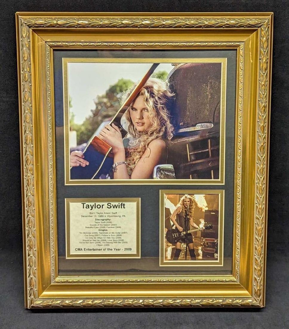 Framed Matted Taylor Swift Matted Memorabilia Board: Framed Matted Taylor Swift Matted Memorabilia Board. Has two photo prints and an information card. This is approx 14 1/2" x 1 1/4" x 17 1/2" and it weighs 2.90lbs. The frame has some small