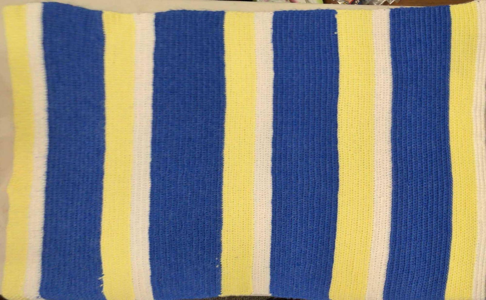 Machine Made Crochet Blanket Blue Yellow White: Here is a machine made crochet blanket with cheerful blue, yellow and white colors. Is approx 34" x 44" and has some light wear and fuzz.