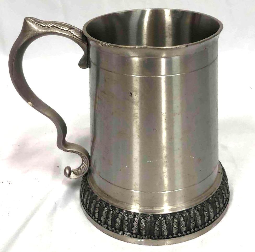 Pewter Pint Tankard With Thistle Handle: This lot contains a pewter pint tankard with a thistle handle. This is the perfect gift for any ale drinker. The pint tankard is approx 5" x 3 1/4" and weighs about 1.2lbs. It is marked on the bottom