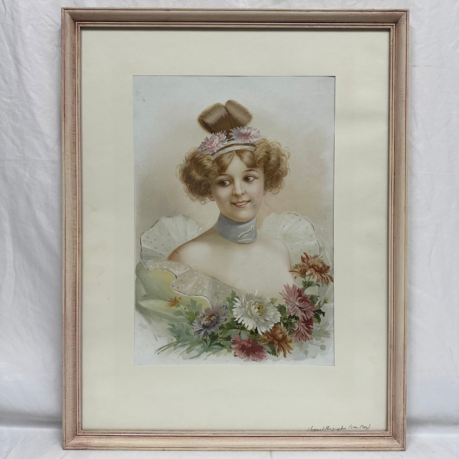 Antique Chromolithograph Portrait of a Victorian Lady Circa 1900 Art Print: Early 20th-century chromolithograph depicting a young Victorian woman with curled hair, a floral headpiece, and a pastel gown adorned with chrysanthemum flowers. Soft color palette typical of turn-of-