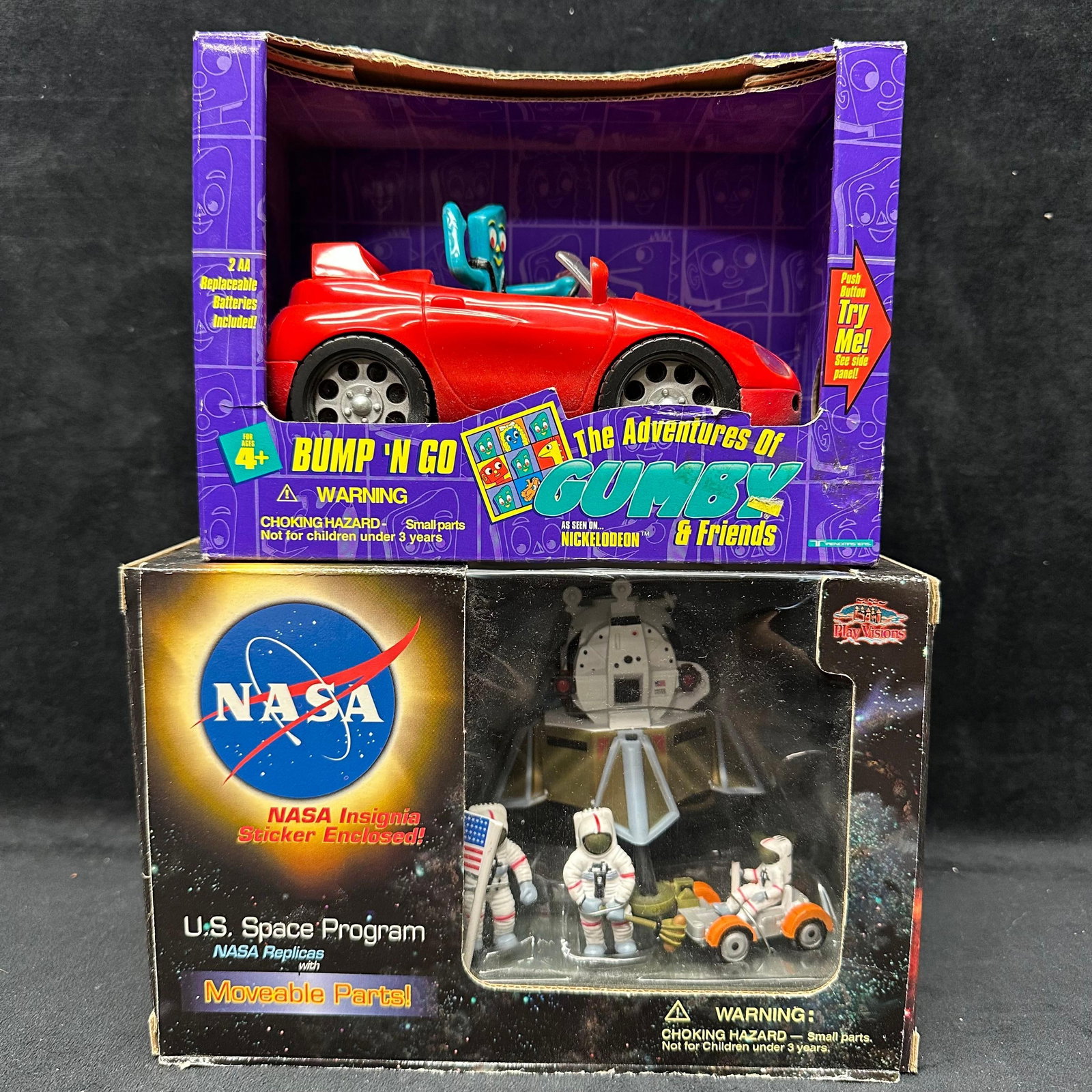 Gumby Bump N Go Vehicle and NASA Space Program Miniatures Toy Lot: The lot includes two boxed vintage toys. First is The Adventures of Gumby and Friends Bump N Go motorized vehicle featuring Gumby in a red convertible, marked Nickelodeon, with original box present. S