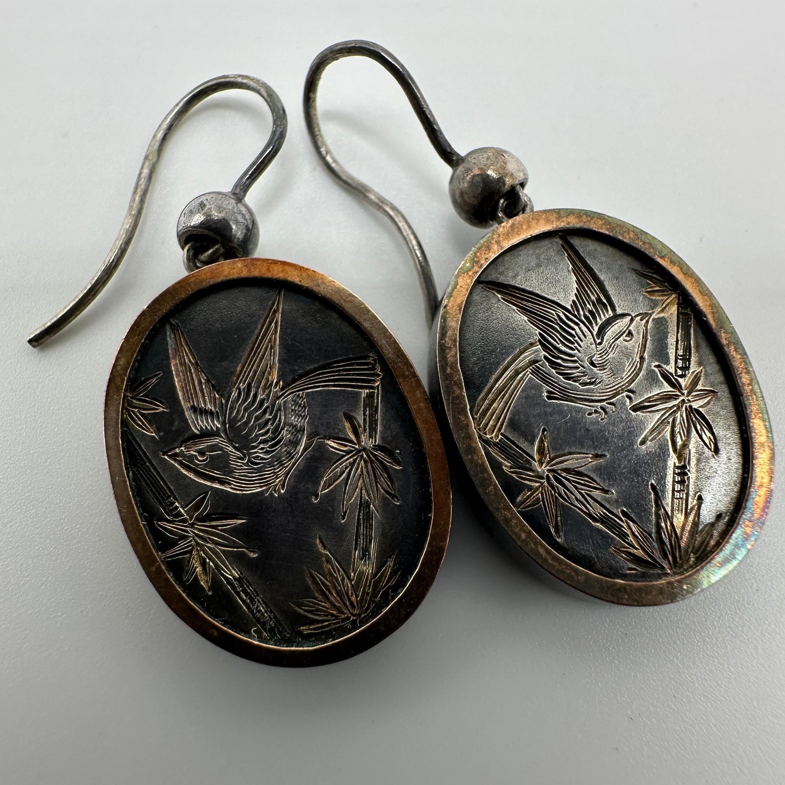 Silver Bird Motif Dangle Earrings X11: This item is in good pre-owned, previously used/displayed condition with noticeable light wear and surface scratches. Please reference all photos for full details. This piece of jewelry has been teste
