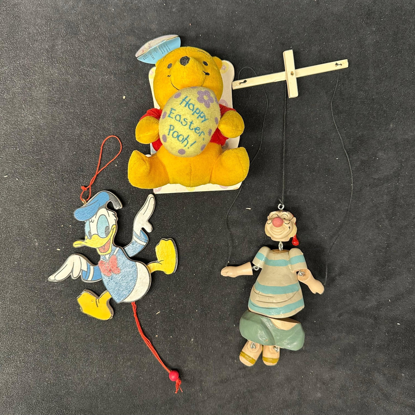 Donald Duck Character Hanging Ornaments and Plush Disney Wood and Fabric: Winnie the Pooh plush with book, a Smee mini puppet, and a Donald Duck wood ornament. These items are in pre-owned, previously displayed condition with light wear and surface scratches/markings. Pleas