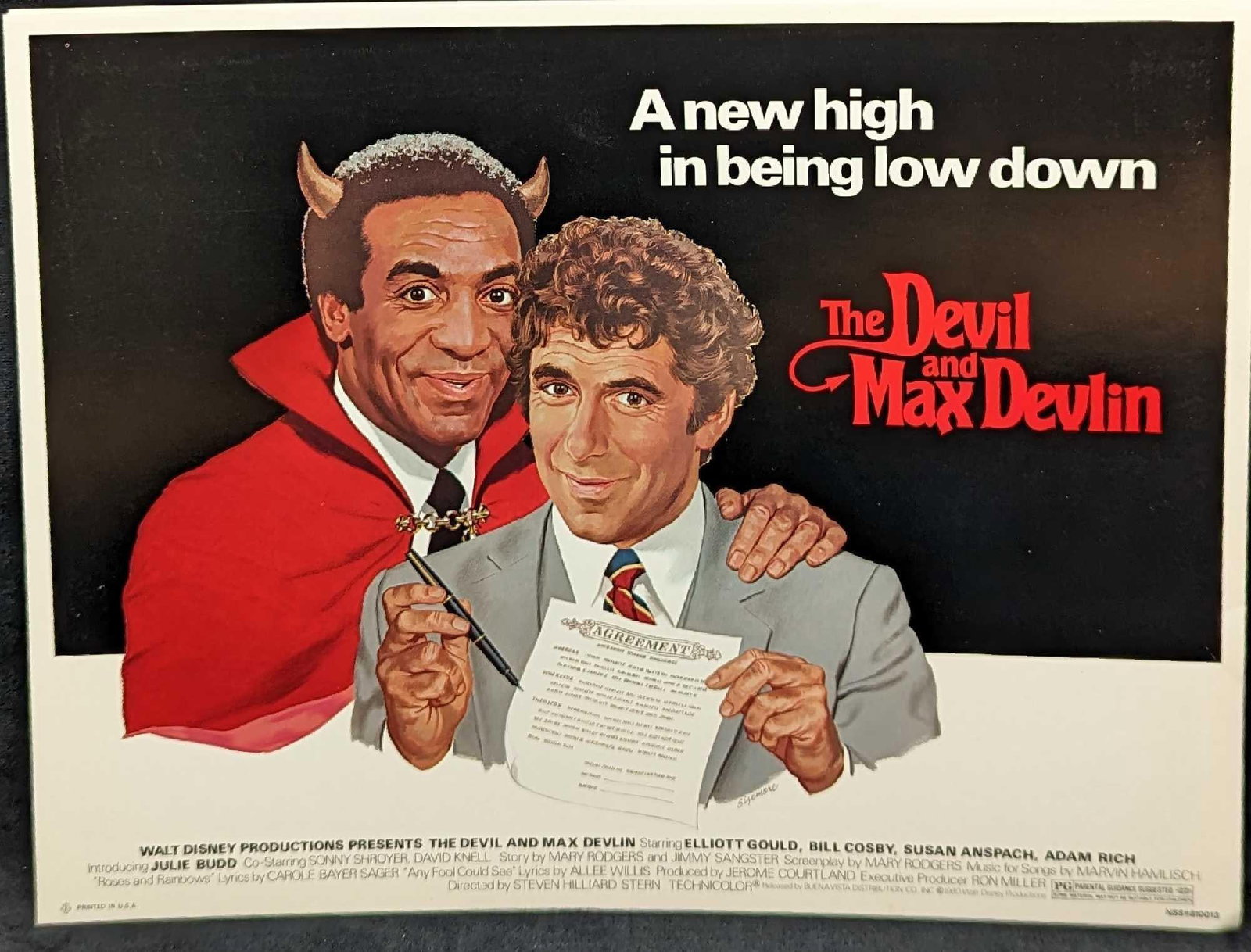Disney The Devil And Max Devlin Full Color Scenes Elliott Gould, Bill Cosby, & Susan Anspach: Disney The Devil And Max Devlin Full Color Scenes. These were released in 1980. Is approx 14 5/8" x 11 1/4" and it weighs 0.50lb. The "scenes" have small creases on the bottom right co