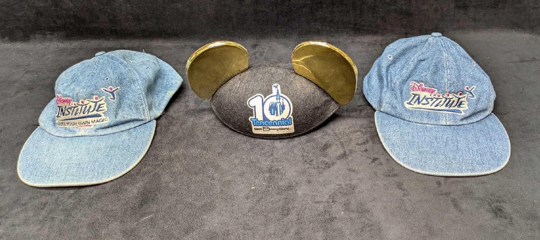 2 Disney Institute Denim Baseball Caps And Tencennial Mickey Ears: 2 Disney Institute Denim Baseball Caps And Tencennial Mickey Ears. This lot comes with: (2) Adult Sized Denim Disney Institute Baseball Caps. Each is approx 8" x 11" x 4". One of the hats