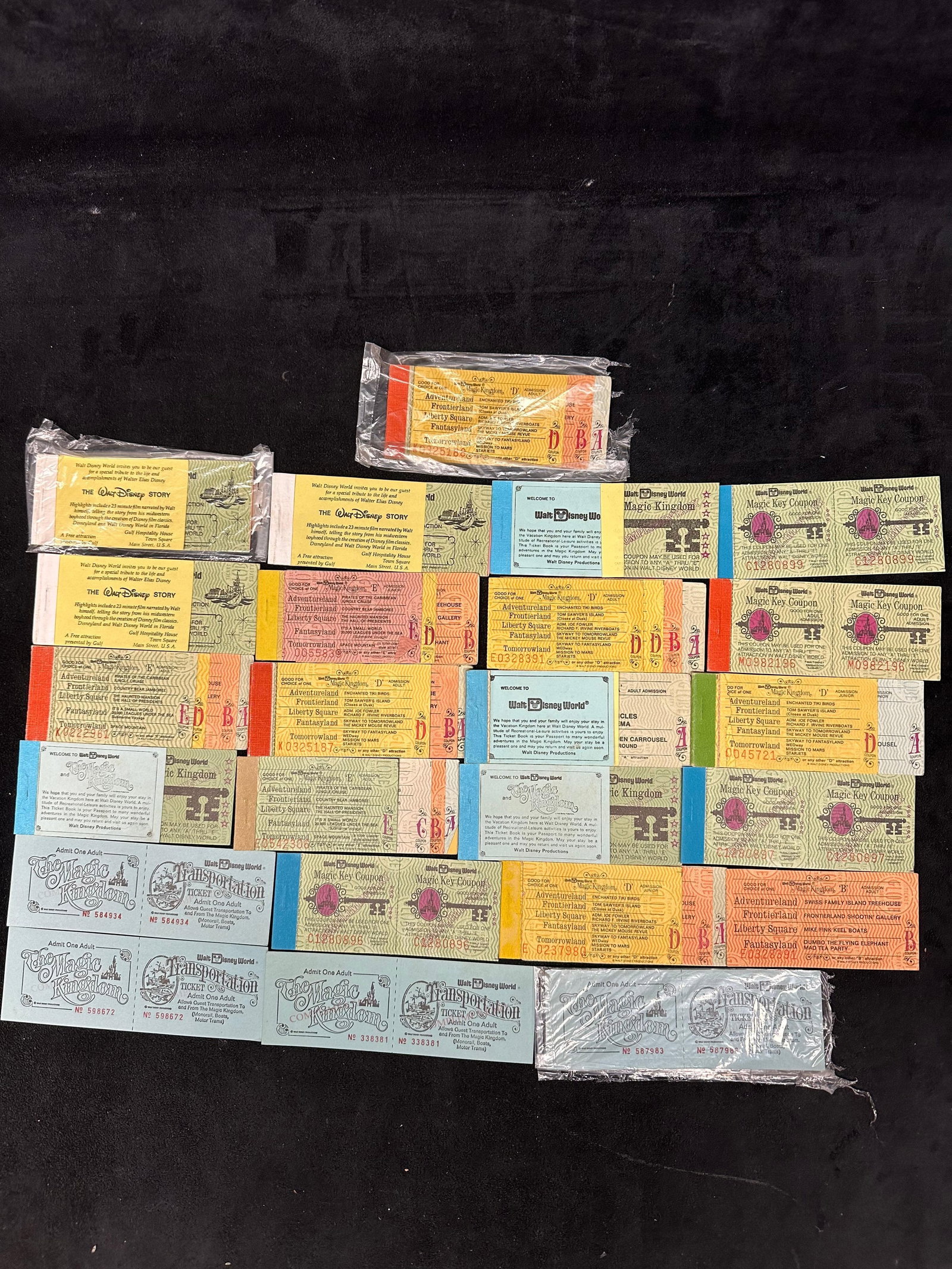 Vintage Walt Disney World Magic Kingdom Admission and Adventure Ticket Books Large Assorted Lot: Large assorted collection of vintage Walt Disney World Magic Kingdom admission tickets and adventure ticket books. Lot includes a wide variety of multi-day and single-day ticket books, Magic Key coupo