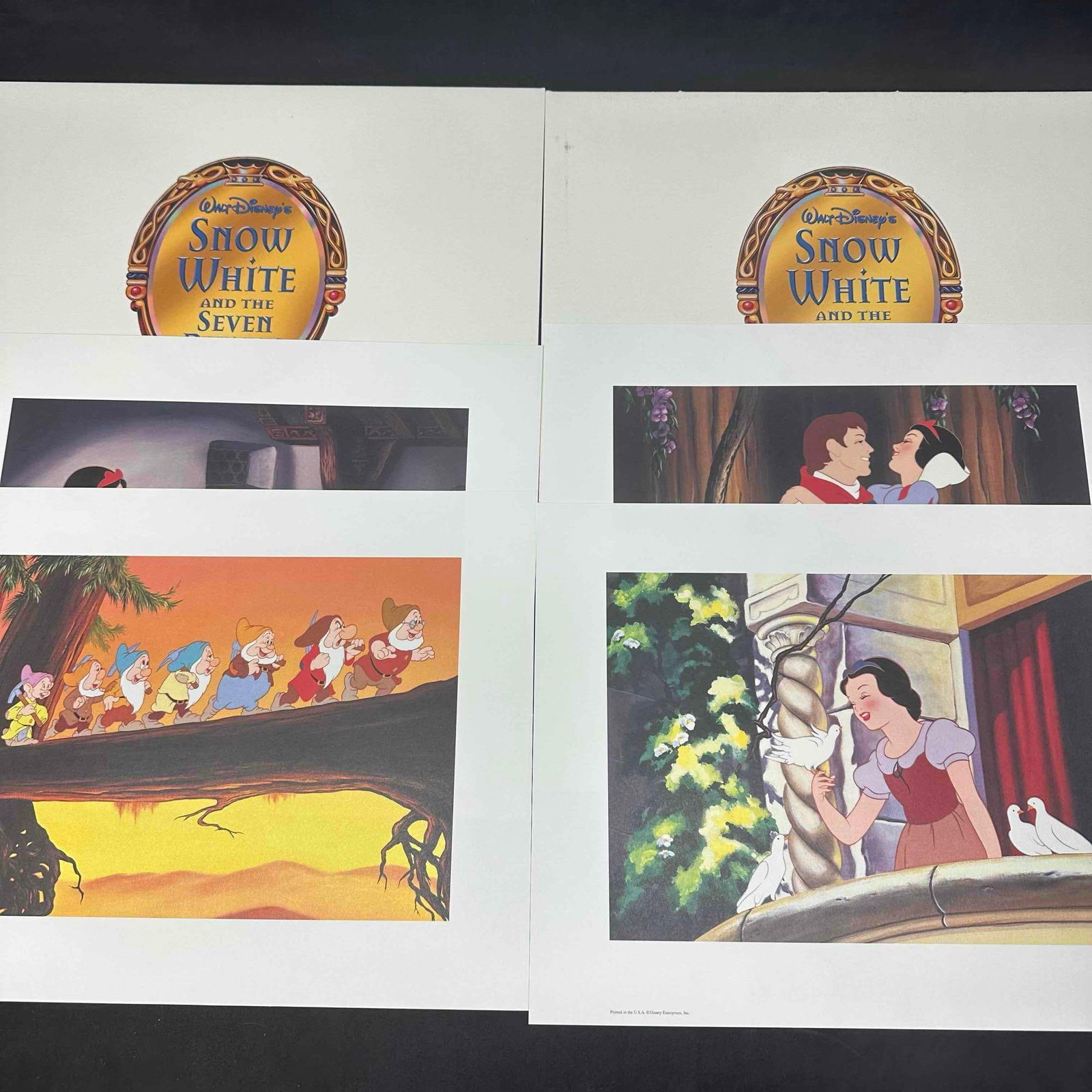 Disney Snow White and the Seven Dwarfs Limited Portfolio Lithographs Set of 8: Walt Disney’s Snow White and the Seven Dwarfs portfolio featuring four lithograph prints. Each print depicts a classic scene from the 1937 animated film, including Snow White with the Prince, Snow W