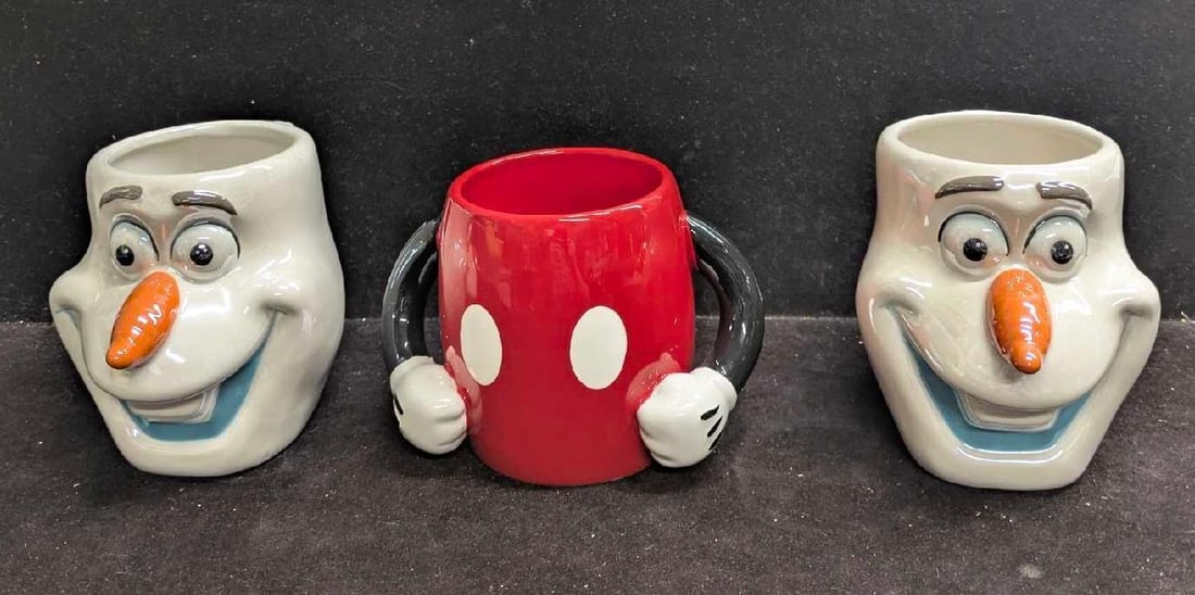 Disney Mickey Mouse And Frozen Olaf 3D Character Mugs: Disney Mickey Mouse And Frozen Olaf 3D Character Mugs. This lot include: (2) Galerie Ceramic Frozen Olaf Character 3D Mug. Each is approx 4 1/2" x 4" x 7". (1) Galerie Mickey Mouse Mug. T