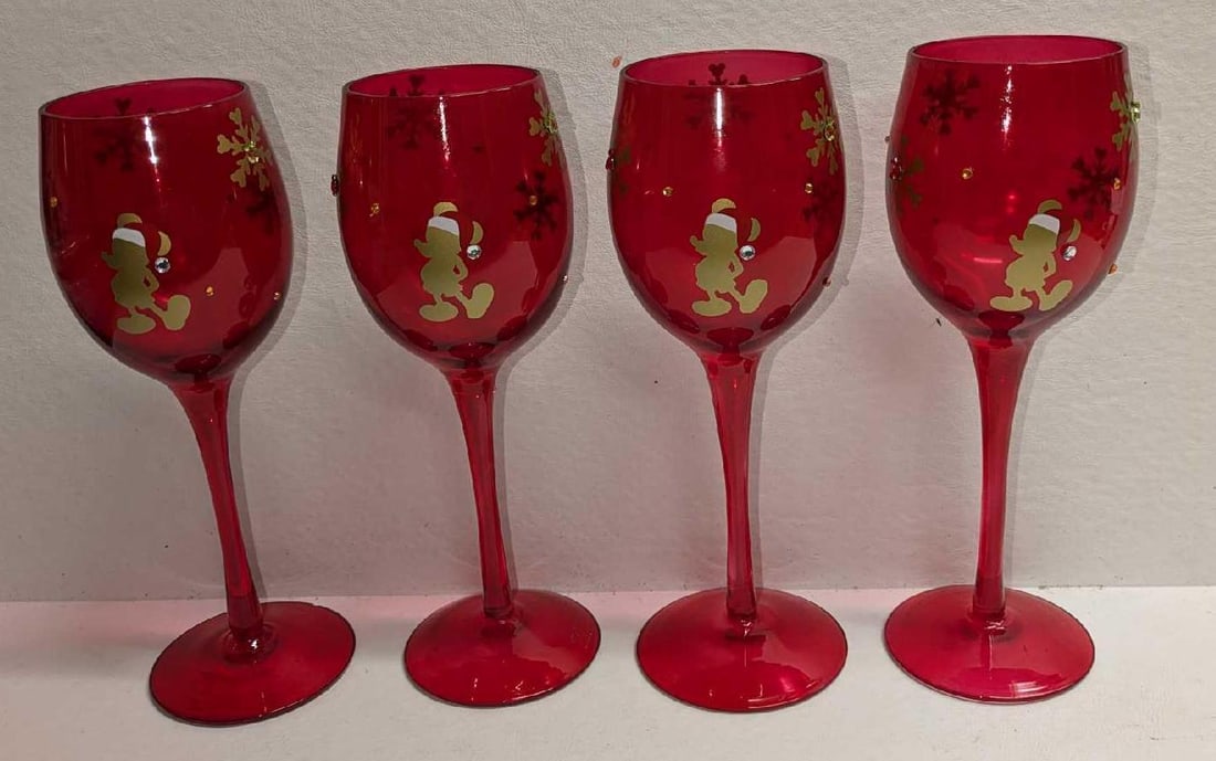 4 Christmas Santa Mickey Glass 9" Red Goblets: 4 Christmas Santa Mickey Glass 9" Red Goblets. Each is approx 3 1/4" x 3 1/4" x 9" and the total weight is 1.90lb. The goblets have no chips or cracks. 