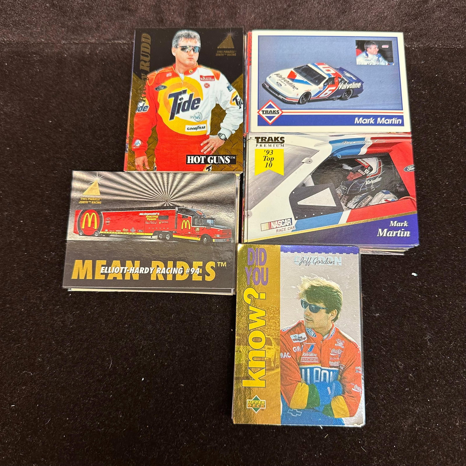 NASCAR Racing Trading Cards Traks Upper Deck Pinnacle Era 100 Card Lot: Group of 100 NASCAR racing trading cards from the 1990s era. Includes cards from sets such as Traks, Upper Deck, Pinnacle, and similar racing card releases. Drivers represented include examples such a
