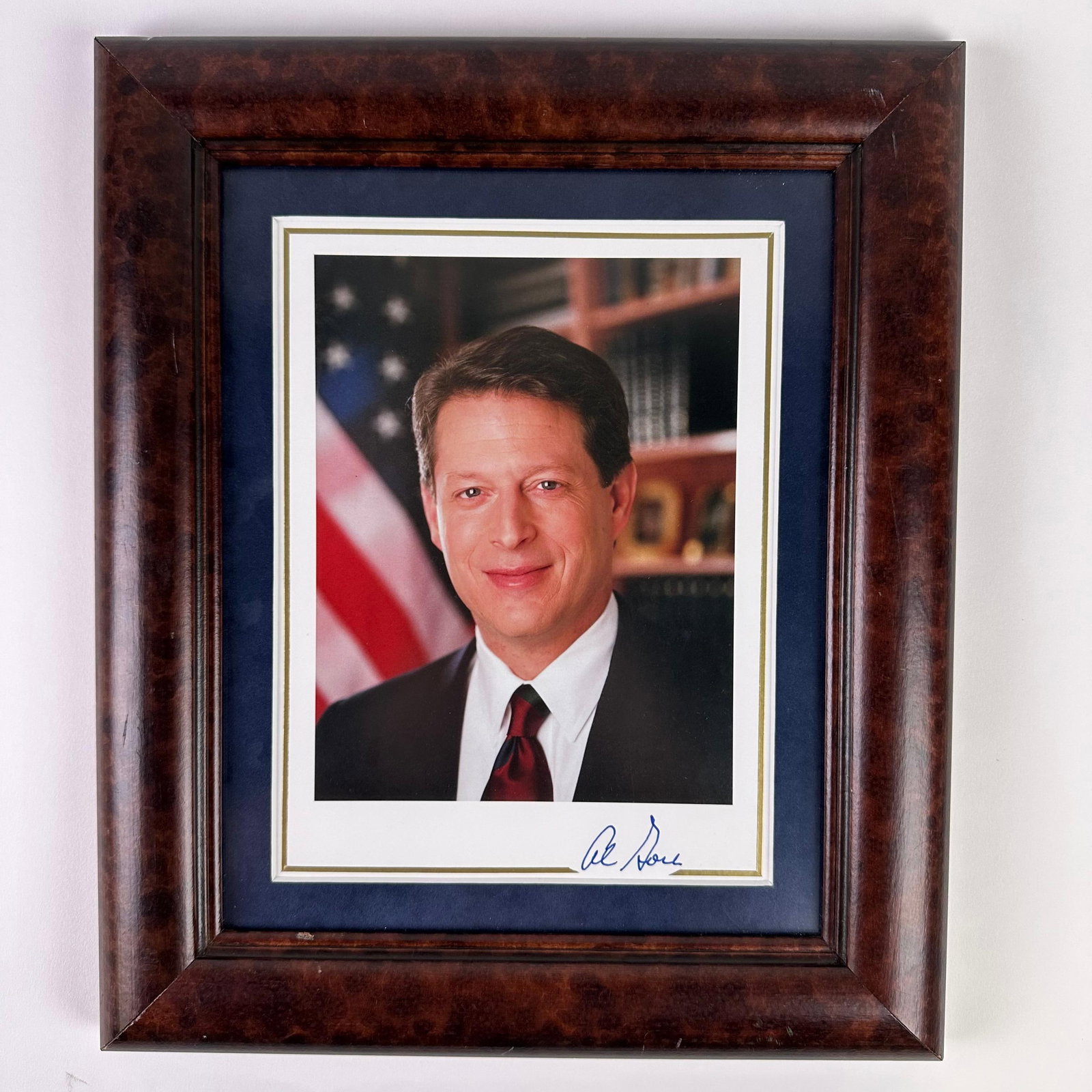 Signed Al Gore Autographed Photograph Framed: Color portrait photograph of Al Gore, former Vice President of the United States (1993–2001), shown in a formal setting with an American flag and bookshelf background. The photograph is hand-signed