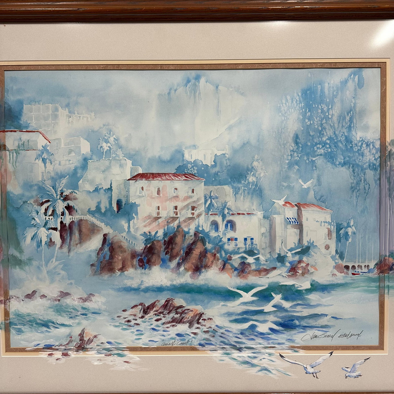 Jim Gerard Amalfi Coast Italy Artist Proof Signed Framed Art Watercolor Painting: Framed print titled “Amalfi Coast” by Florida artist Jim Gerard. Signed lower right and marked Artist Proof. The image depicts a coastal Mediterranean Italian village scene with waves, rocky s