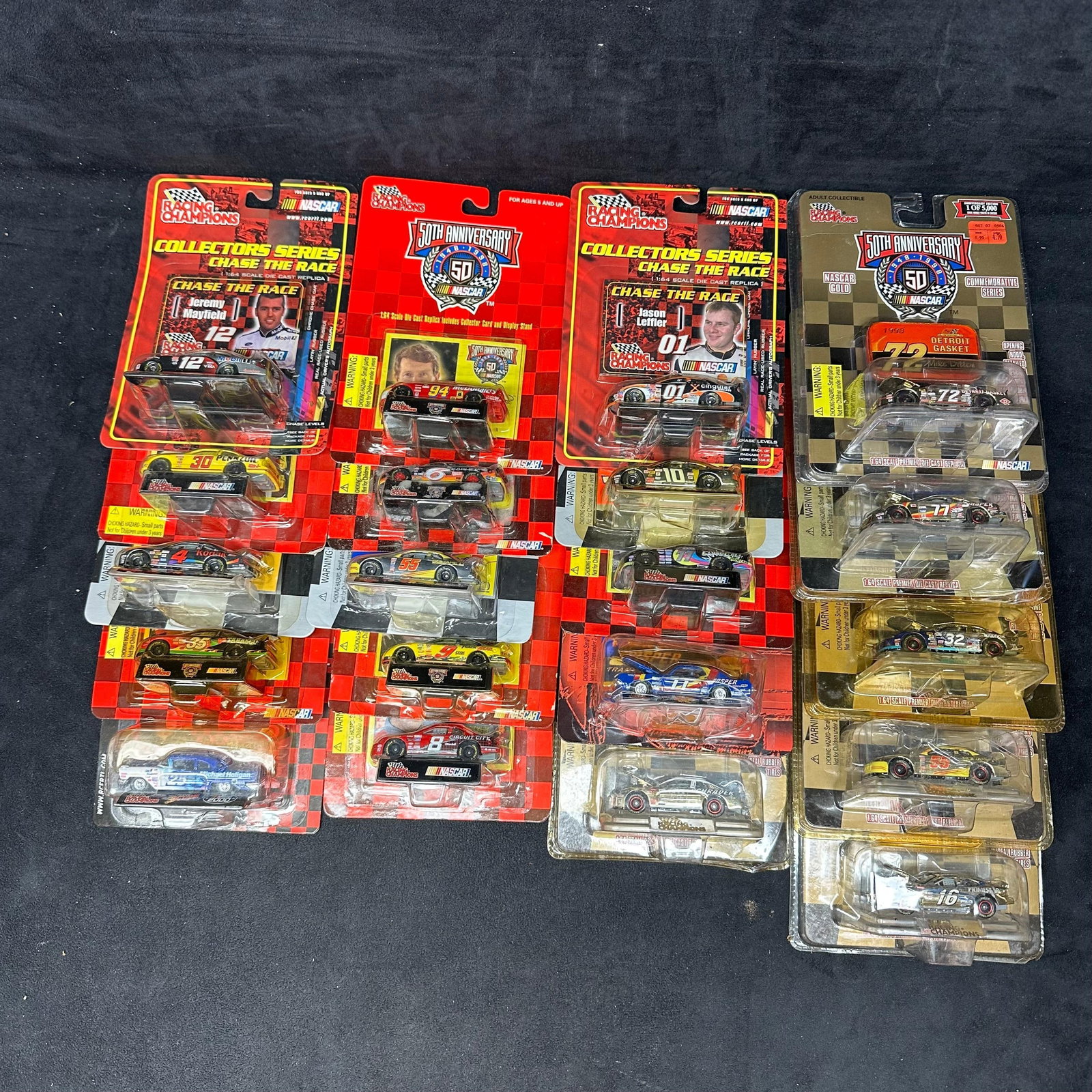 Twenty Car Lot Racing Champions NASCAR 1:64 Diecast Cars Collectors Series and 50th Anniversary: Large group of Racing Champions NASCAR 1:64 scale diecast cars, including examples from the Collectors Series Chase the Race, 50th Anniversary NASCAR commemorative releases, and NASCAR Gold series. V