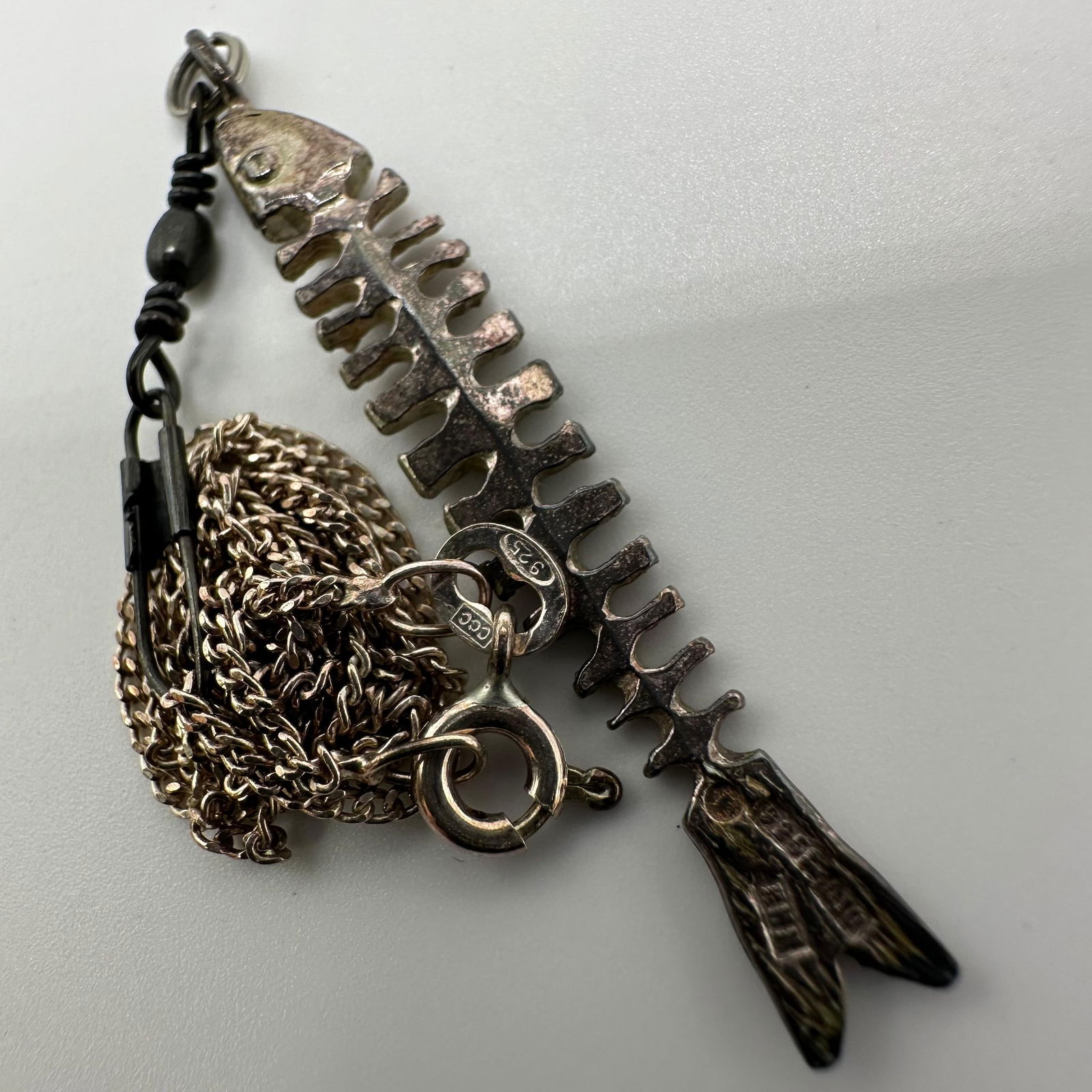 Sterling Silver Fish Skeleton 925 Necklace and Pendant: This item is in good pre-owned, previously used/displayed condition with noticeable light wear and surface scratches. Please reference all photos for full details. This piece of jewelry has been