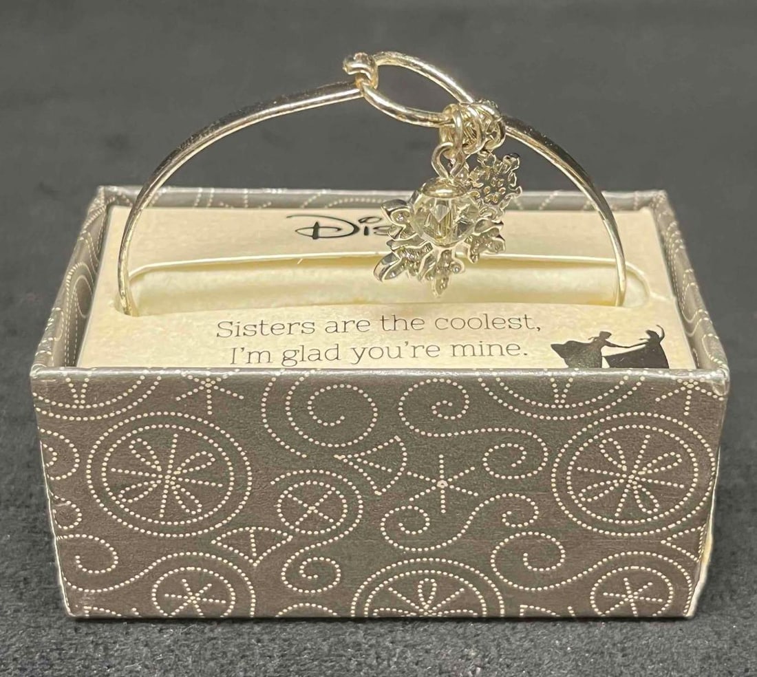 Disney Frozen Bracelet Sisters Are The Coolest, I'm Glad You're Mine In Original Box: This lot contains a Disney Frozen Bracelet Sisters Are The Coolest, I'm Glad You're Mine In Original Box. It is approx 2" x 3 1/4" x 3 1/4". Total weight is 1.4oz. Overall the Bracelet is in