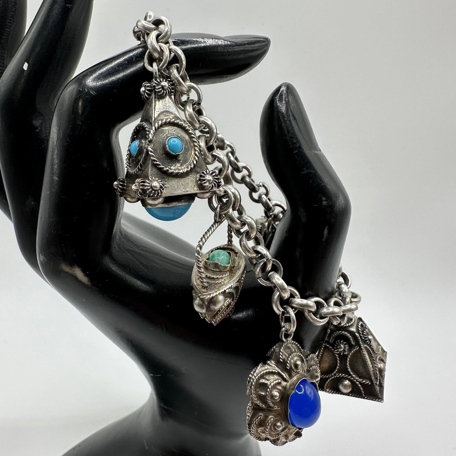 Italian Etruscan Revival Charm Bracelet 800 Silver X52: This item is in good pre-owned, previously used/displayed condition with noticeable light wear and surface scratches. Please reference all photos for full details. This piece of jewelry has been