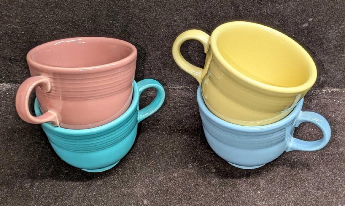 Four Fiestaware Flat Cups: Four Fiestaware Flat Cups. Each cup is approx 4 1/2" x 3 1/2" x 2 3/4" and the total weight is 2.26lbs. Please see the images for a listing of the colors.