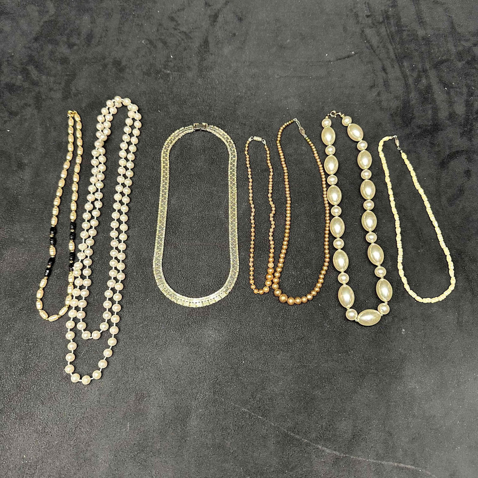 Lot of Seven Vintage Beaded Costume Necklaces Rhinestone Gold Tone Faux Pearl Beads K9: This lot includes seven vintage necklaces featuring a variety of styles and materials. The group consists of a long faux pearl, plastic and glass beads, and other materials. Each piece shows light wea