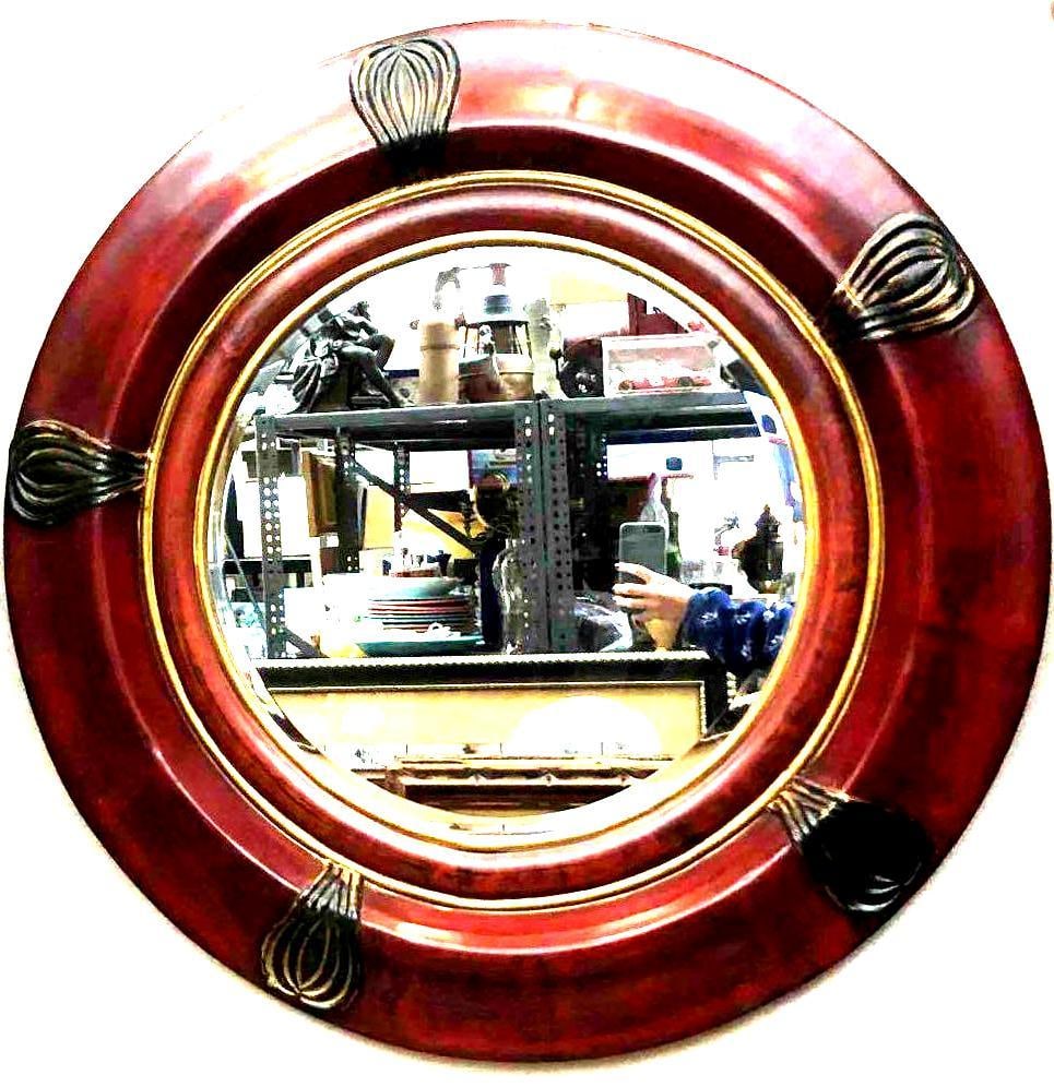Large Decorative Round Wall Mirror: This lot contains a large decorative round wall mirror. The mirror is approx 36 1/2" x 36 1/2" and weighs about 28lbs. The mirror frame is made of pressed particle board with a lacquer finish. Overall