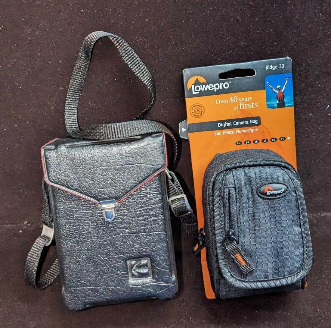 Lowepro Digital & Kodak Vintage Camera Cases: Lowepro Digital & Kodak Vintage Camera Cases. This lot includes: (1) Lowepro Digital Camera Bag - Ridge 30. This is still attached to its regular box that is approx 4 1/4" x 2" x