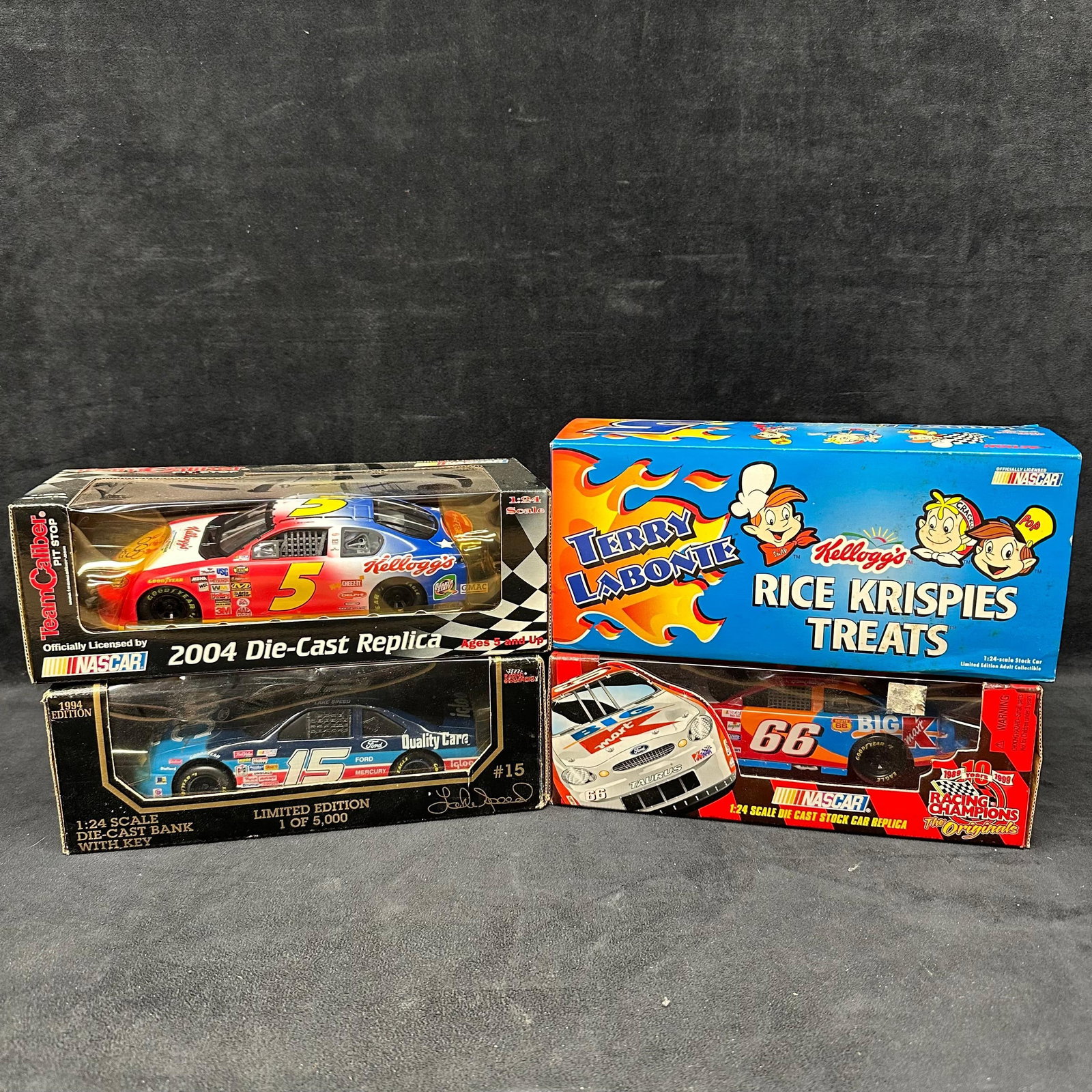 Die-Cast Cars Terry Labonte Dale Jarrett Todd Bodine and More Lot of 4 NASCAR 1:24 Scale: Collection of four NASCAR 1:24 scale die-cast stock cars, each boxed. Includes Terry Labonte Kellogg’s Rice Krispies Treats car, Kellogg’s 2004 Team Caliber replica, Quality Care Ford by Revell Li