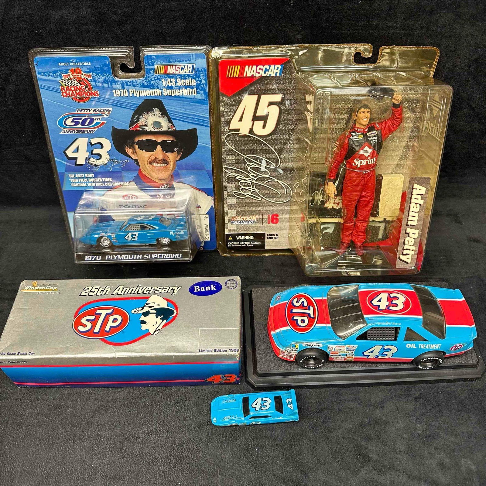 Petty Racing Collectibles NASCAR Richard and Adam Petty Die Cast Car Replica Set: Various collection of NASCAR Petty Racing stock car collectibles featuring (5) die cast cars in different scale size. These collectibles are in like new and pre-owned condition with some never being r
