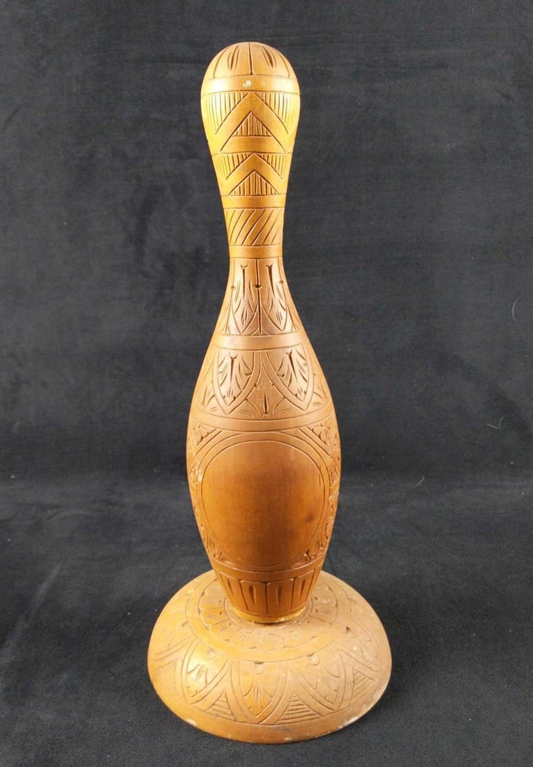 Vintage Hand Carved Wooden Bowling Pin With Stand: Hand carved wooden bowling ball pin with stand. According to the previous owner, this bowling ball pin was found at the US Embassy in Germany in the 1950s. It appears that it might have been made to b